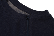 Load image into Gallery viewer, Close-up view of raglan-sleeve top in navy demonstrating detailing of ribbed crew-neck trim, zipper pull covers, and fabric texture