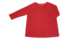 Load image into Gallery viewer, Full view of women&#39;s raglan-sleeve top in tomato color featuring bracelet-length sleeves, two double-welt front pockets, and both upper chest zippers in zipped position
