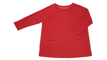 Load image into Gallery viewer, Full view of women's raglan-sleeve top in tomato color featuring bracelet-length sleeves, two double-welt front pockets, and both upper chest zippers in zipped position