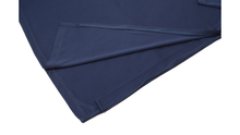 Load image into Gallery viewer, Close-up view of navy polo dress hemline demonstrating side zipper details
