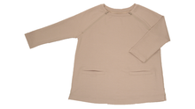 Load image into Gallery viewer, Full view of women&#39;s raglan-sleeve top in taupe featuring bracelet-length sleeves, two double-welt front pockets, and both upper chest zippers in zipped position

