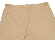 Load image into Gallery viewer, Close-up view of khaki pants to demonstrate detailing of rear welt pockets and expandable side button adjustment
